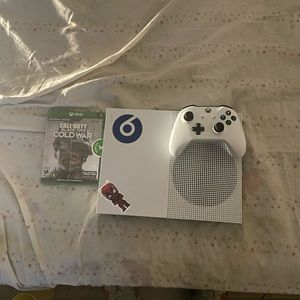 Xbox One S , I bought it on StockX . No scratches !!!